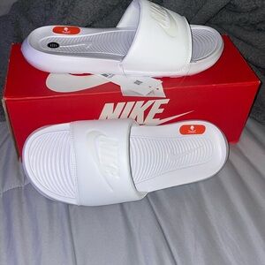 White enhanced comfort Nike slides